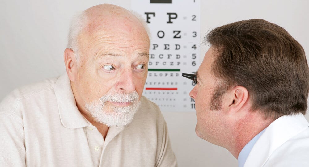 Old man in an eye examination